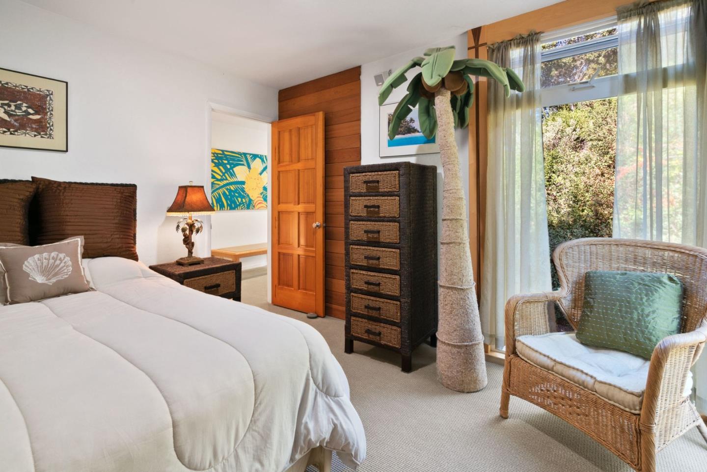 7625 Oak Ridge Road Aptos, CA 95003 - Photo 37 of 67 a bedroom with a bed a couch and a large window