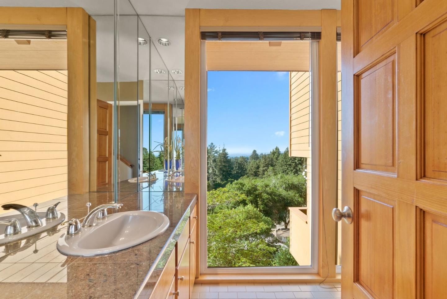 7625 Oak Ridge Road Aptos, CA 95003 - Photo 39 of 67 a bathroom with a granite countertop sink and a mirror