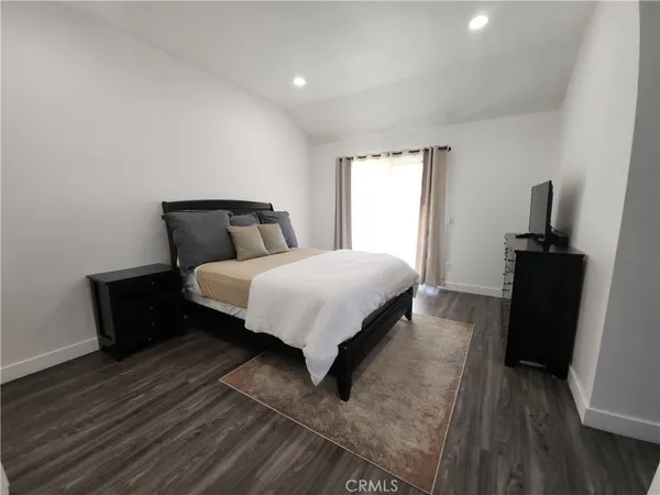 a bed room with a bed and a night stand