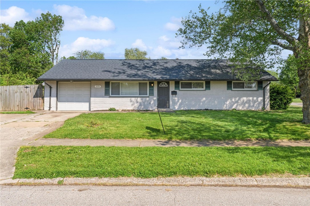 3890 Endover Road Dayton, OH 45439 - Photo 1 of 26 This charming residence features a well-maintained exterior, a lush lawn, and an attached garage.