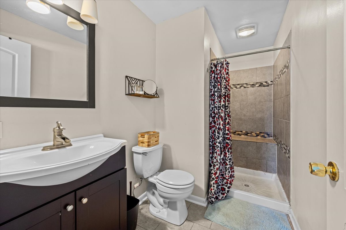 2-n651 Beith Road Elburn, IL 60119 - Photo 15 of 24 a bathroom with a sink toilet and shower