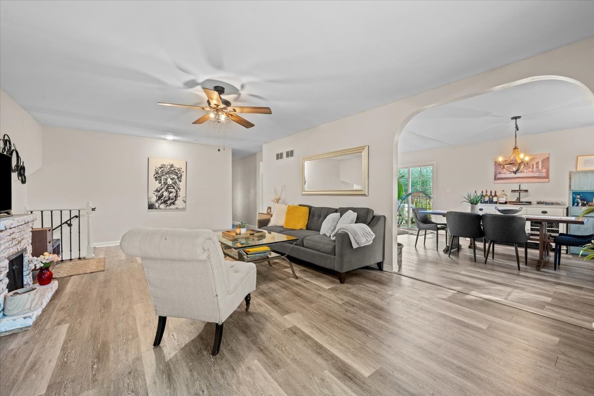 2-n651 Beith Road Elburn, IL 60119 - Photo 7 of 24 a living room with furniture and a chandelier