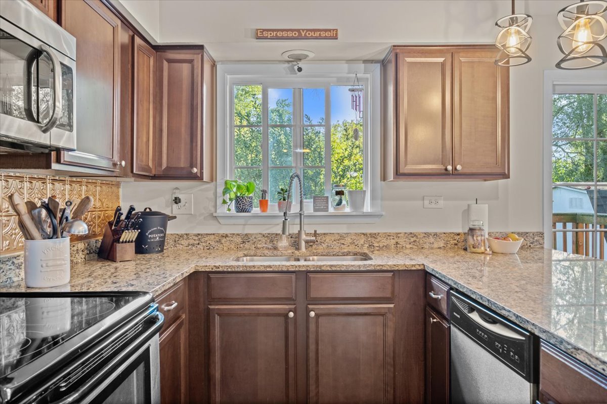 2-n651 Beith Road Elburn, IL 60119 - Photo 9 of 24 a kitchen with a sink stove top oven and cabinets