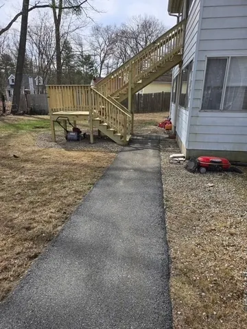 a view of a house with a yard