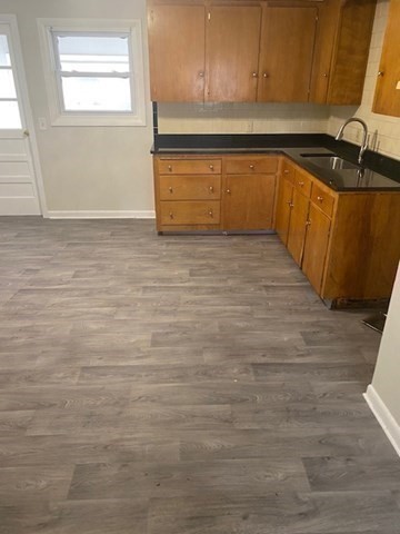 3 Colonial Avenue, Unit 2 Thompson, CT 06277 - Photo 4 of 10 a view of a kitchen with wooden cabinet and a sink