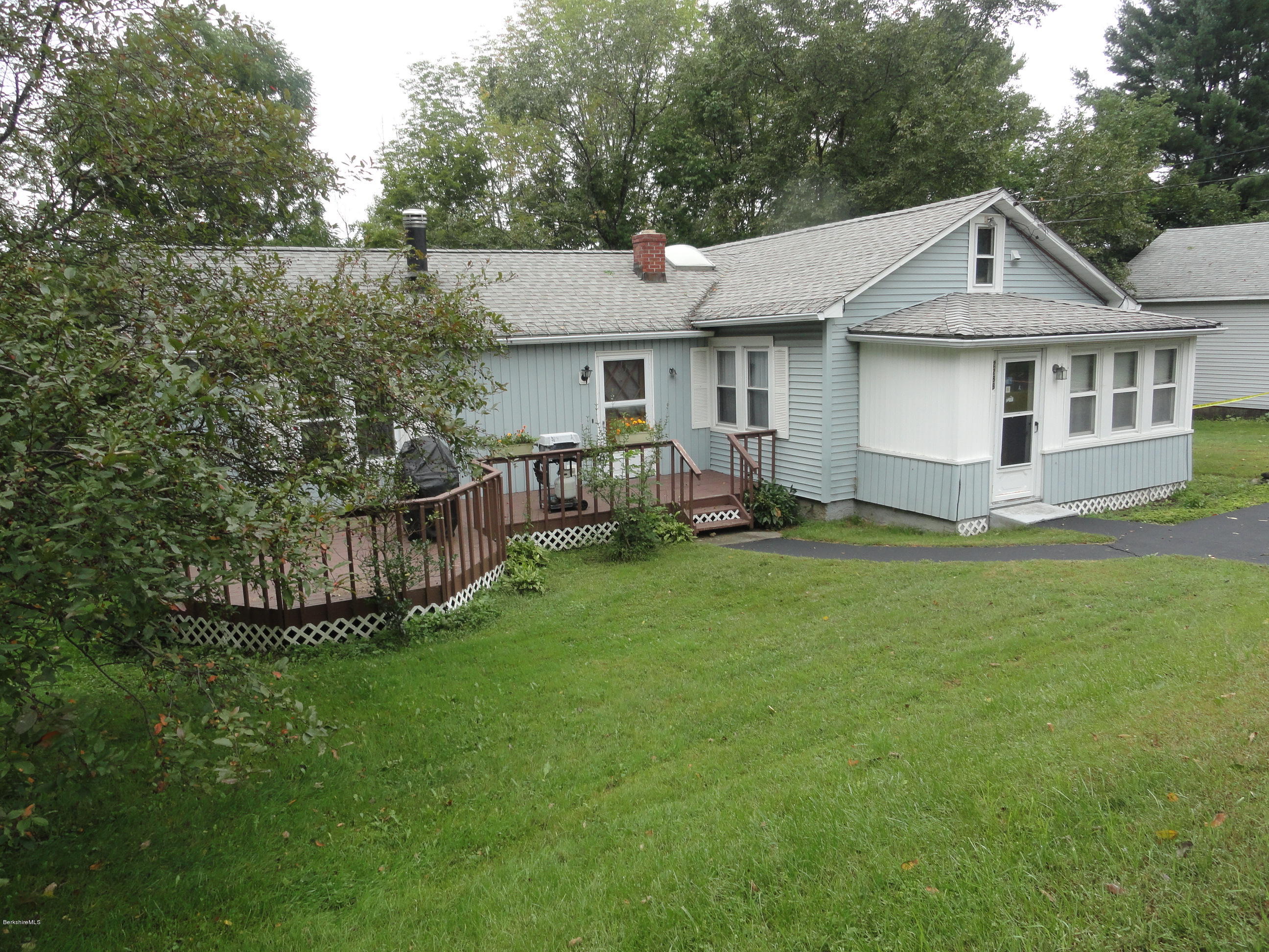 2288 State Road Richmond, MA 01254 - Photo 1 of 10 a front view of a house with a garden and yard