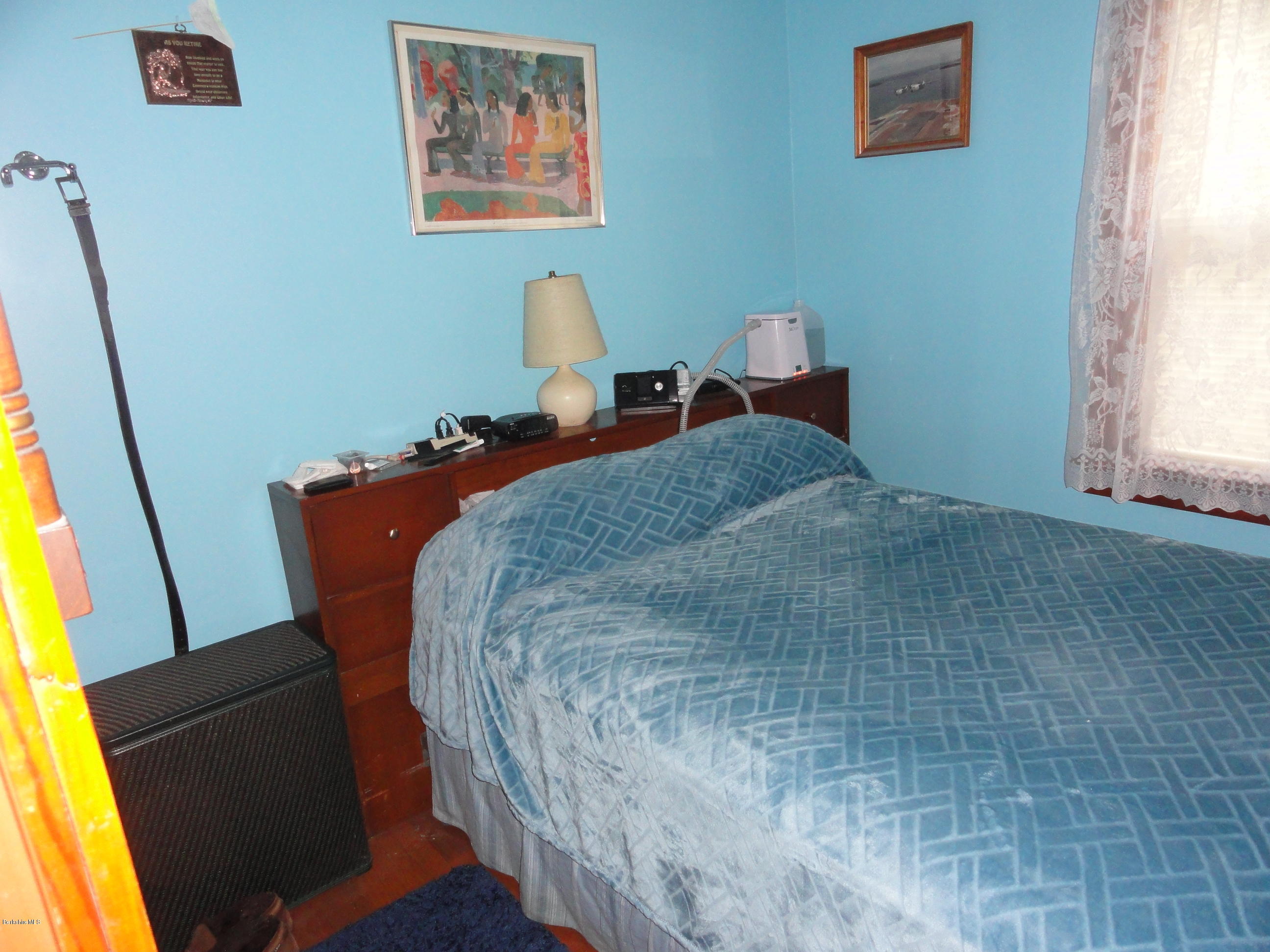 2288 State Road Richmond, MA 01254 - Photo 5 of 10 a bed sitting in a bedroom next to a window