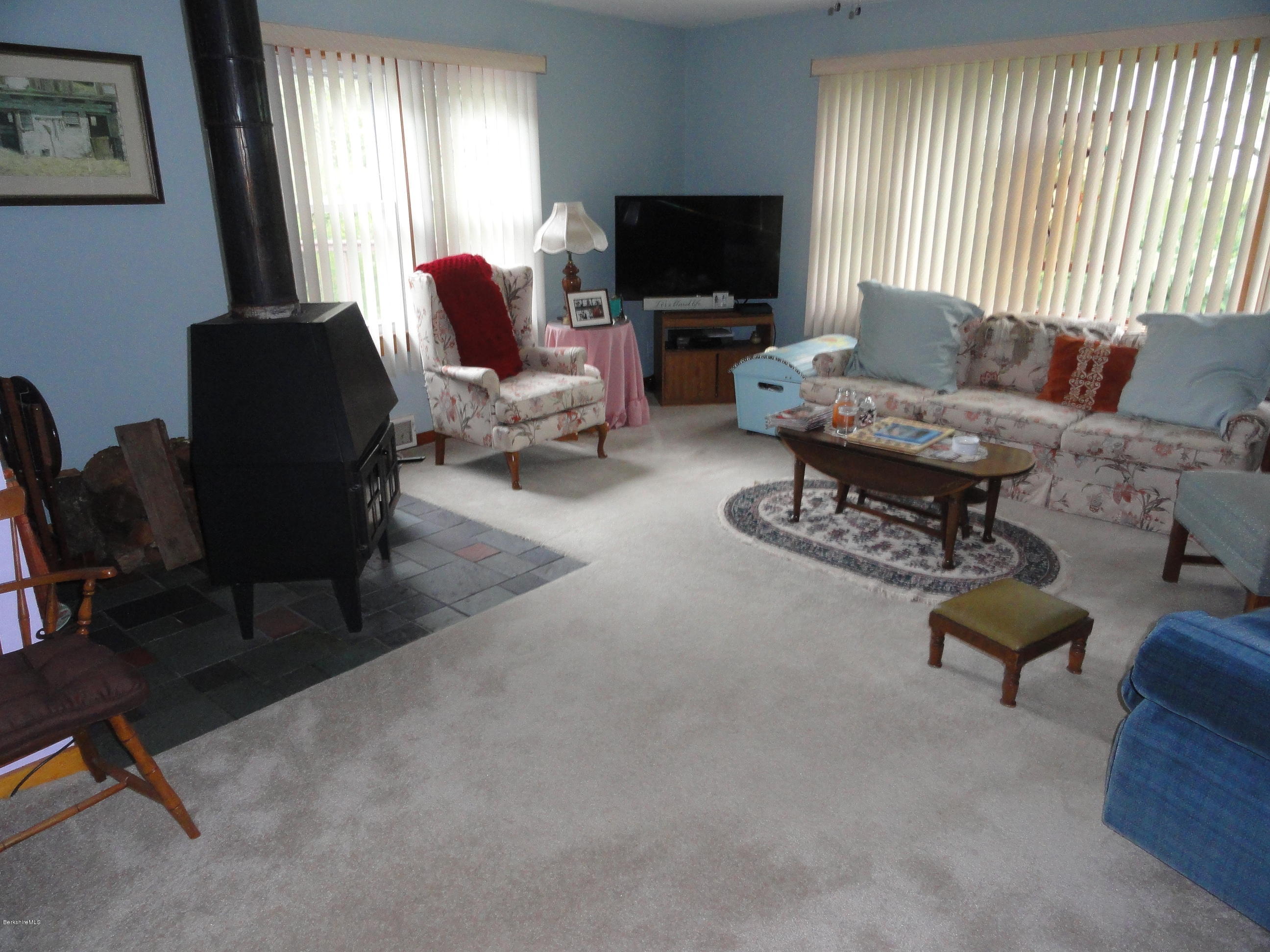 2288 State Road Richmond, MA 01254 - Photo 7 of 10 a living room with furniture and a flat screen tv