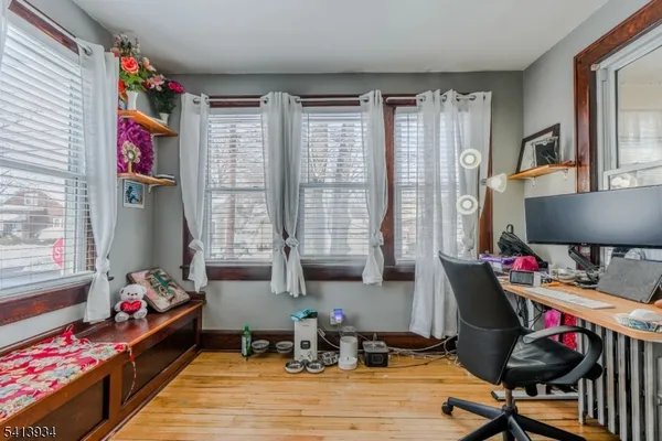 a living room with furniture and a floor to ceiling window