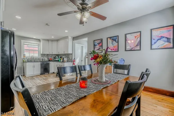 a kitchen view with dining table and chairs