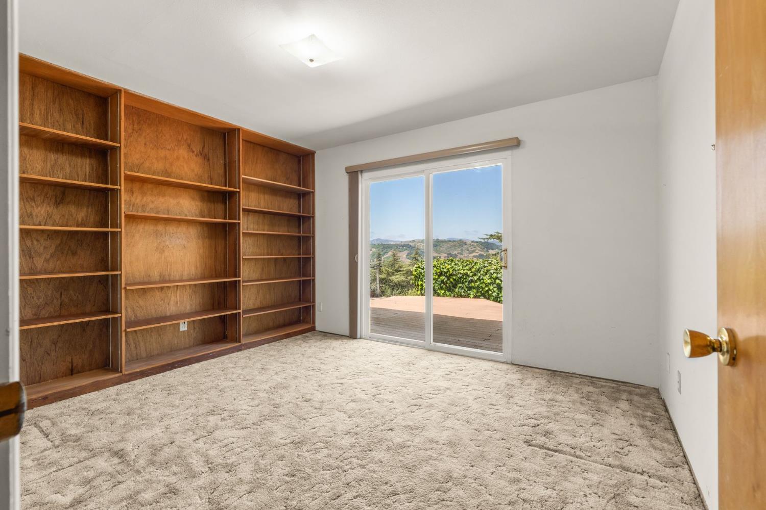 25 Hill Street Oak View, CA 93022 - Photo 6 of 16 a view of an empty room with a fireplace and a window