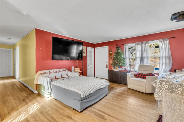 a bedroom with a bed and a couch