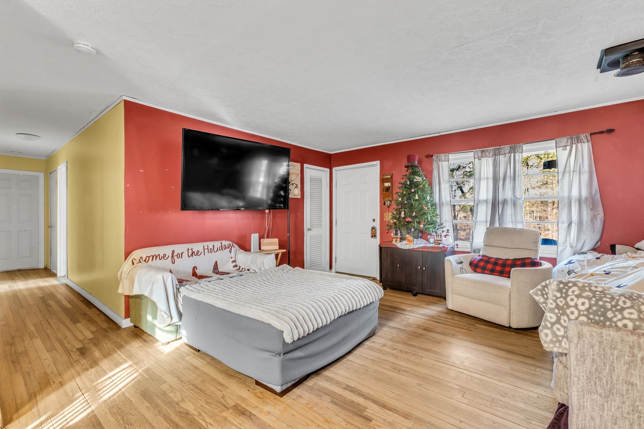 7880 Johnny Crow Road Lyles, TN 37098 - Photo 2 of 29 a bedroom with a bed and a couch