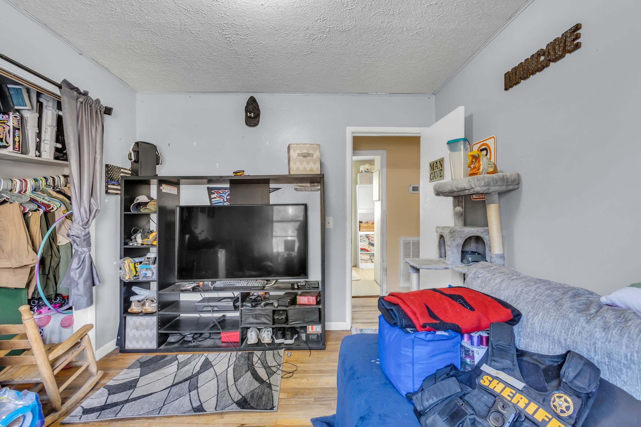 7880 Johnny Crow Road Lyles, TN 37098 - Photo 21 of 29 a living room with furniture and a flat screen tv
