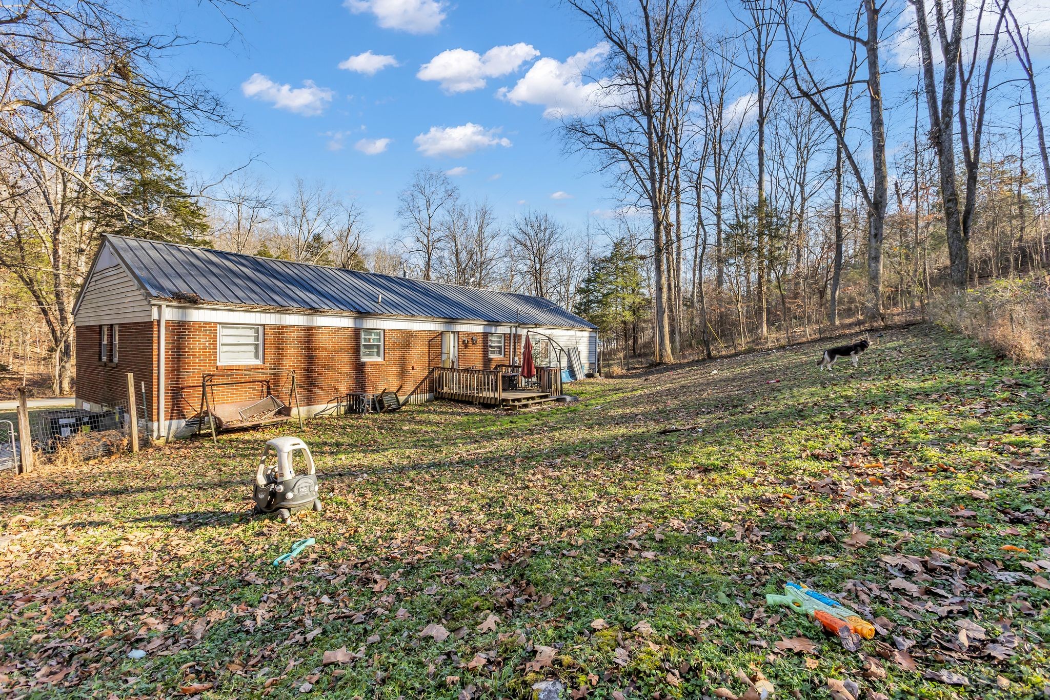 7880 Johnny Crow Road Lyles, TN 37098 - Photo 26 of 29 a backyard of a house with table and chairs