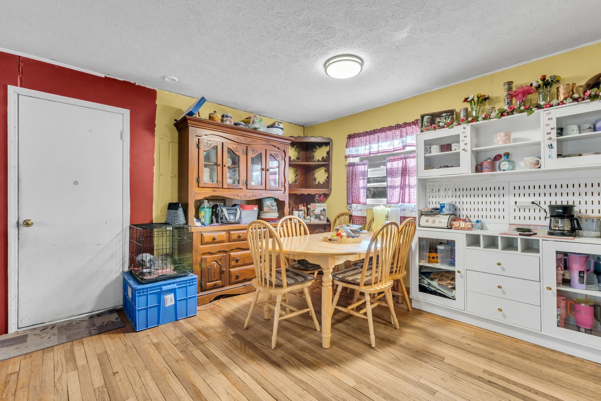 7880 Johnny Crow Road Lyles, TN 37098 - Photo 7 of 29 a view of a dining room with furniture and wooden floor