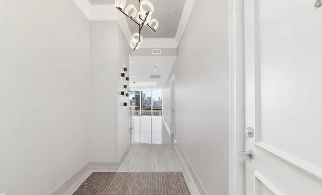 a kitchen with stainless steel appliances a refrigerator and a stove top oven