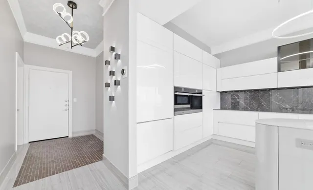 a bathroom with a double vanity sink toilet and shower