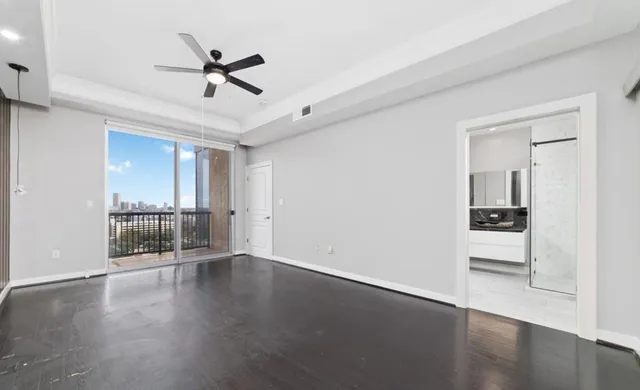 a view of walk in closet with empty racks