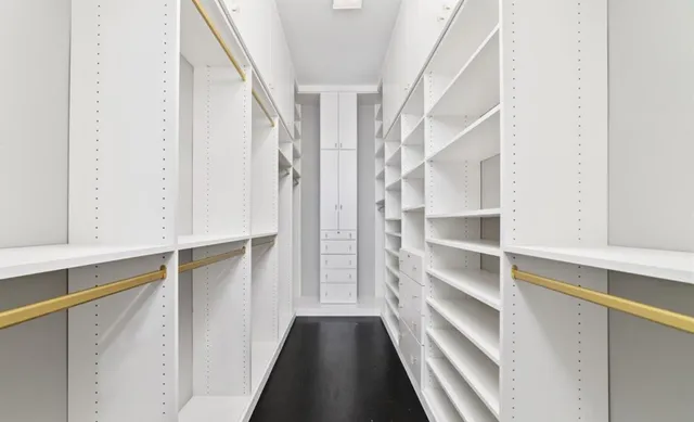 a view of an empty walk in closet