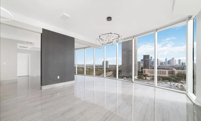 a view of a room window and wooden floor