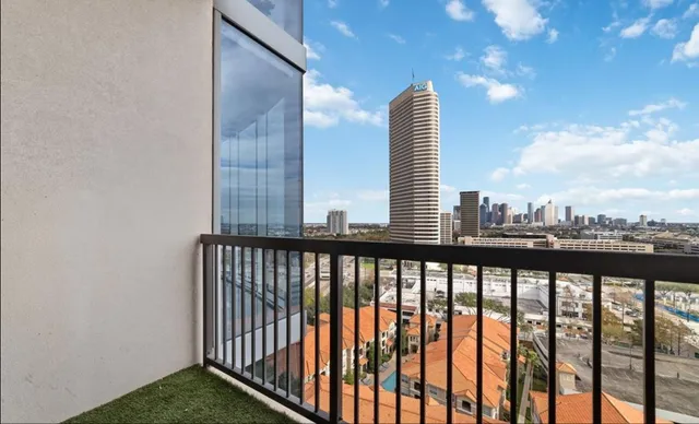 a bathroom with a granite countertop toilet sink and mirror