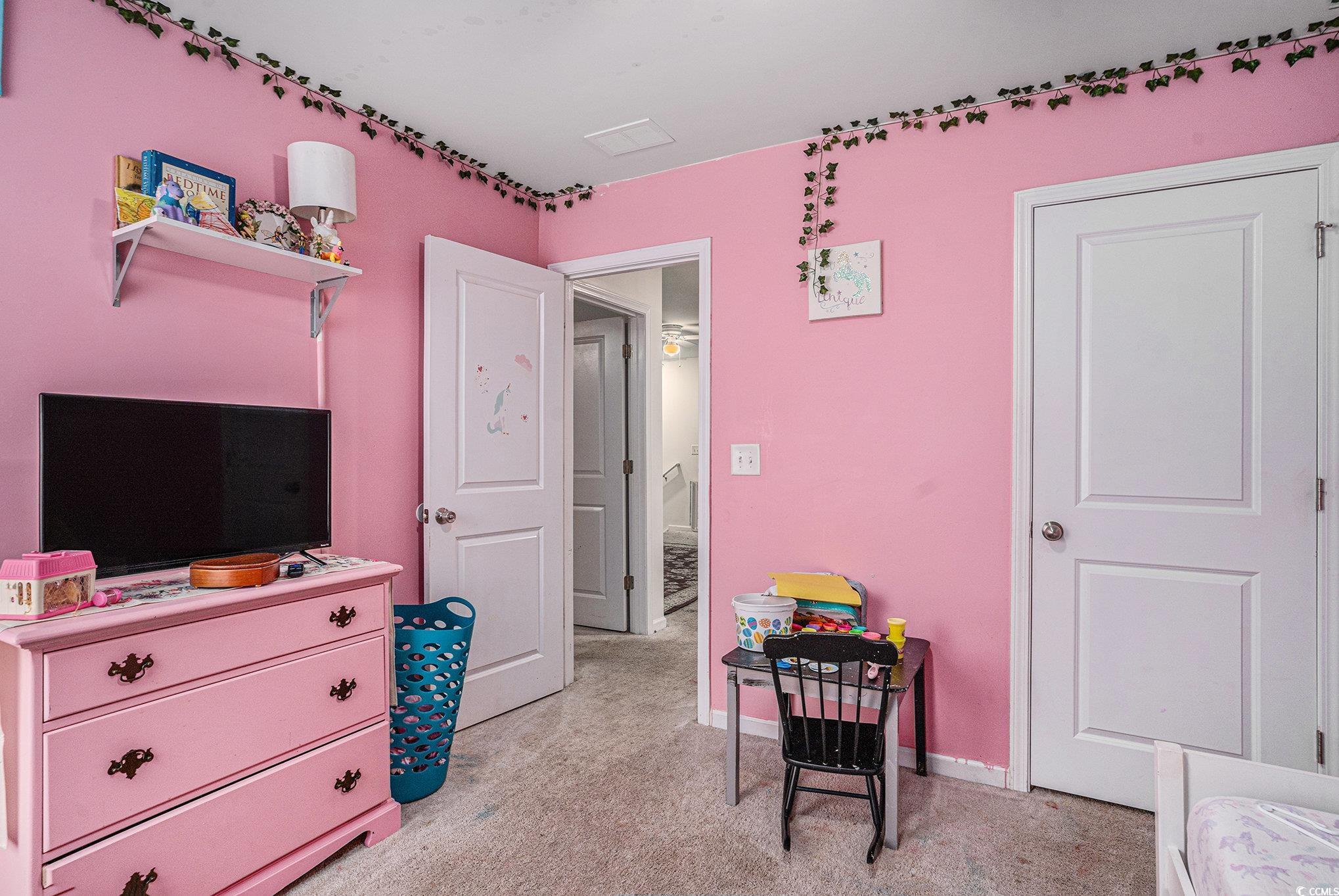 2059 Borgata Loop Longs, SC 29568 - Photo 15 of 34 Bedroom with light colored carpet and baseboards