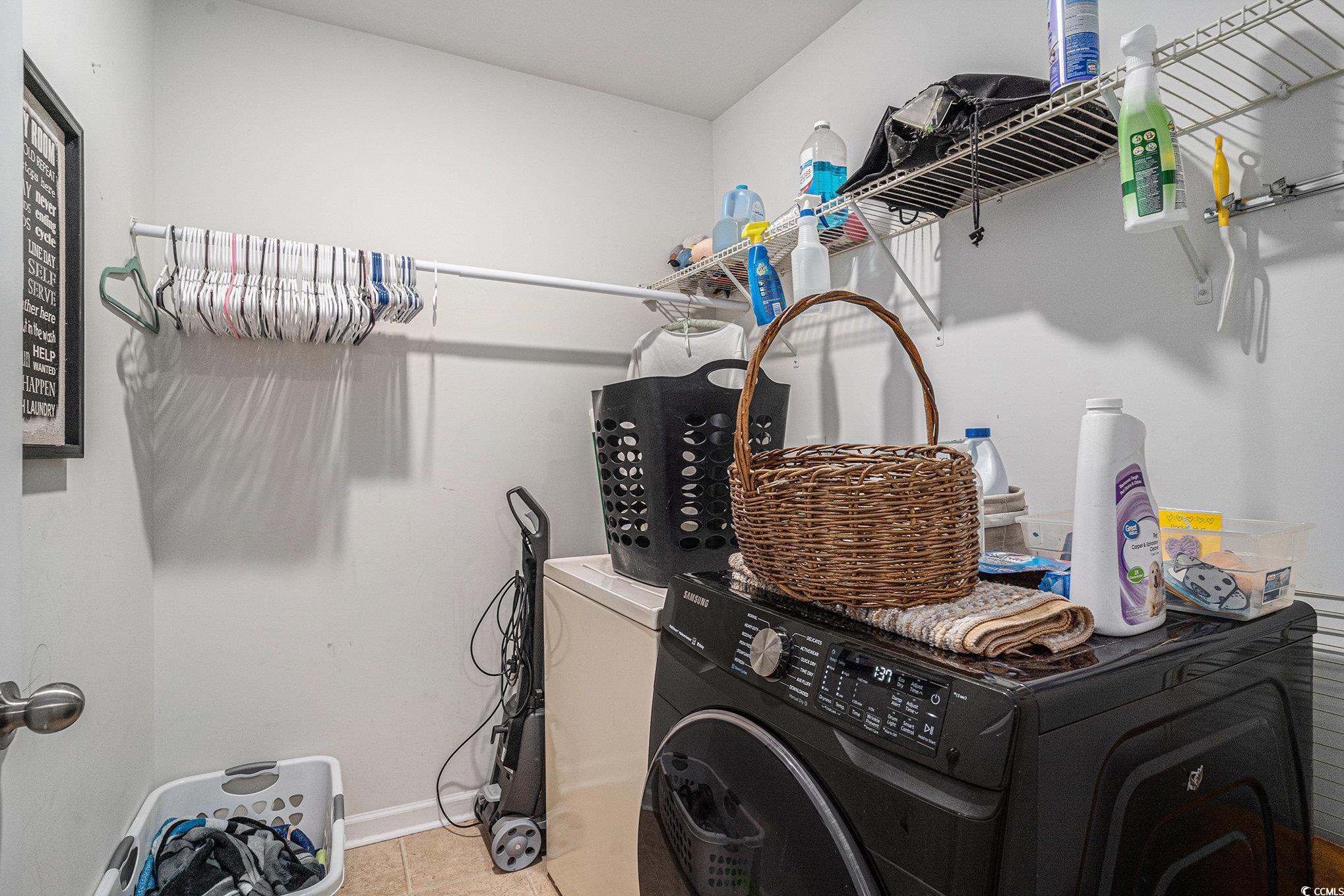 2059 Borgata Loop Longs, SC 29568 - Photo 16 of 34 Washroom with washer / clothes dryer, light tile p