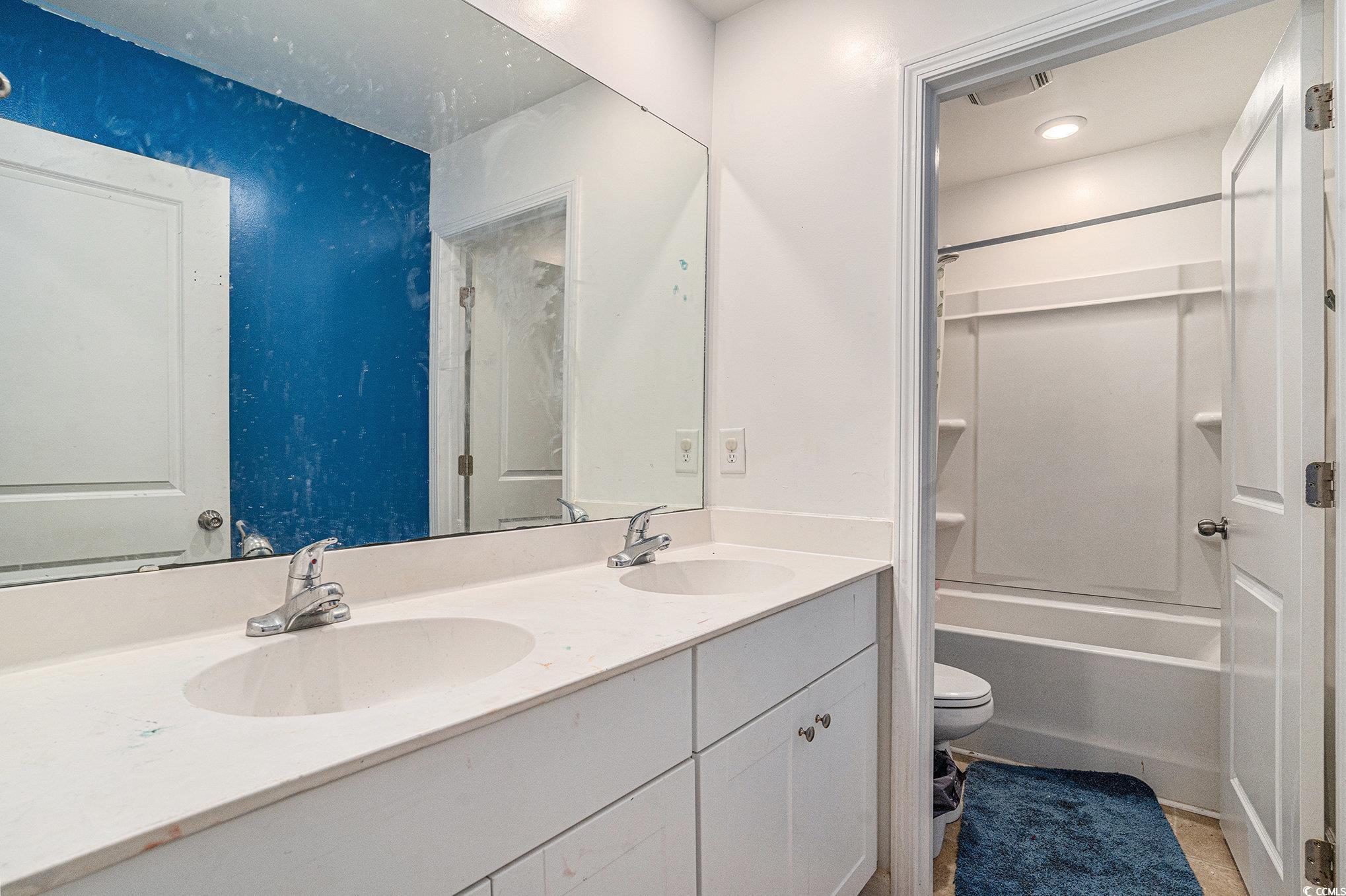 2059 Borgata Loop Longs, SC 29568 - Photo 18 of 34 Full bathroom featuring toilet, double vanity, and