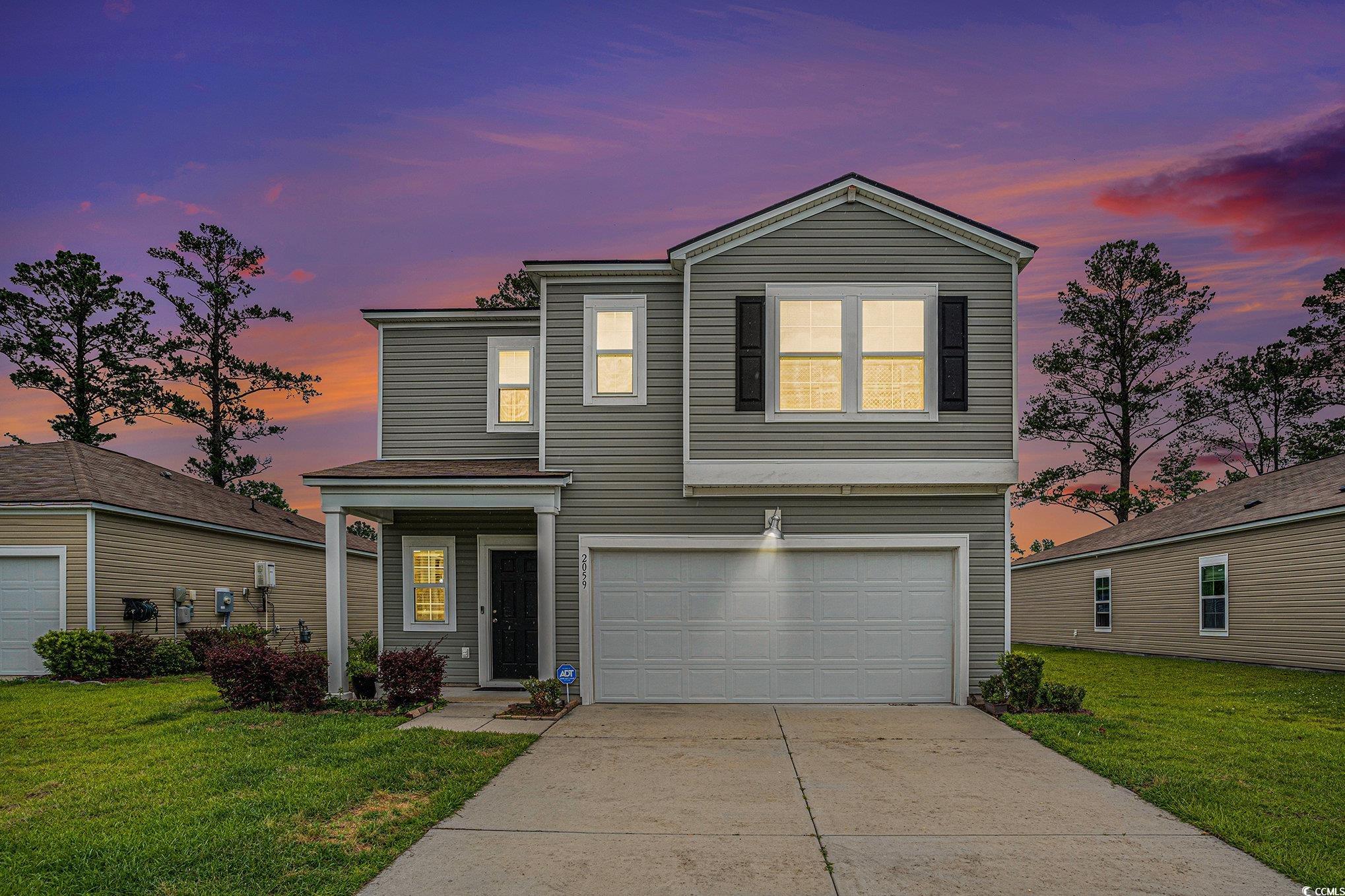 2059 Borgata Loop Longs, SC 29568 - Photo 2 of 34 Traditional-style home with a garage, concrete dri