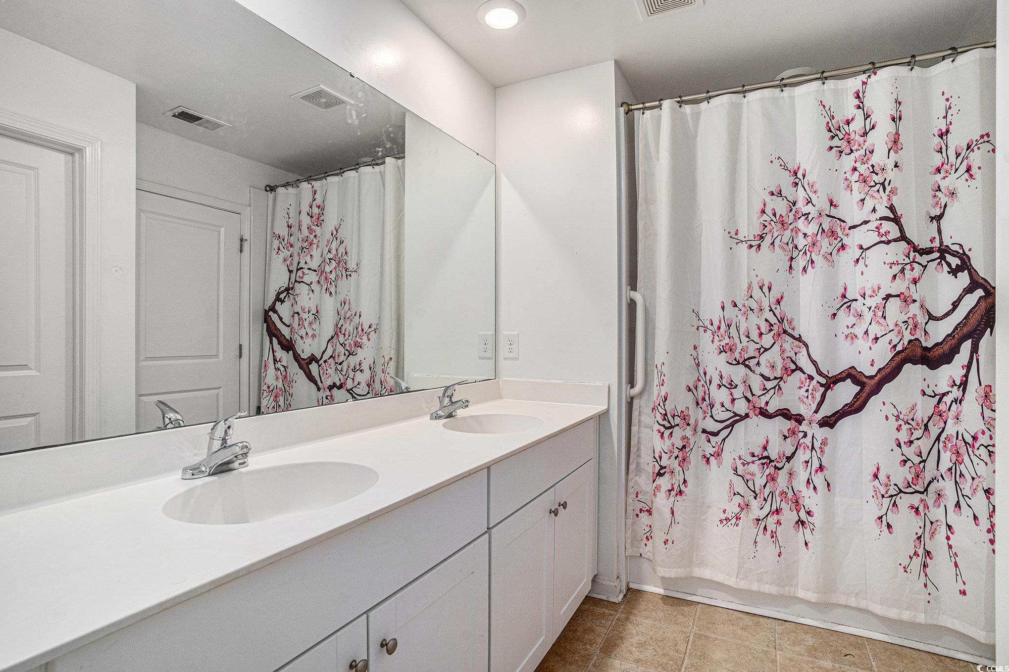 2059 Borgata Loop Longs, SC 29568 - Photo 25 of 34 Full bath featuring double vanity, tile patterned