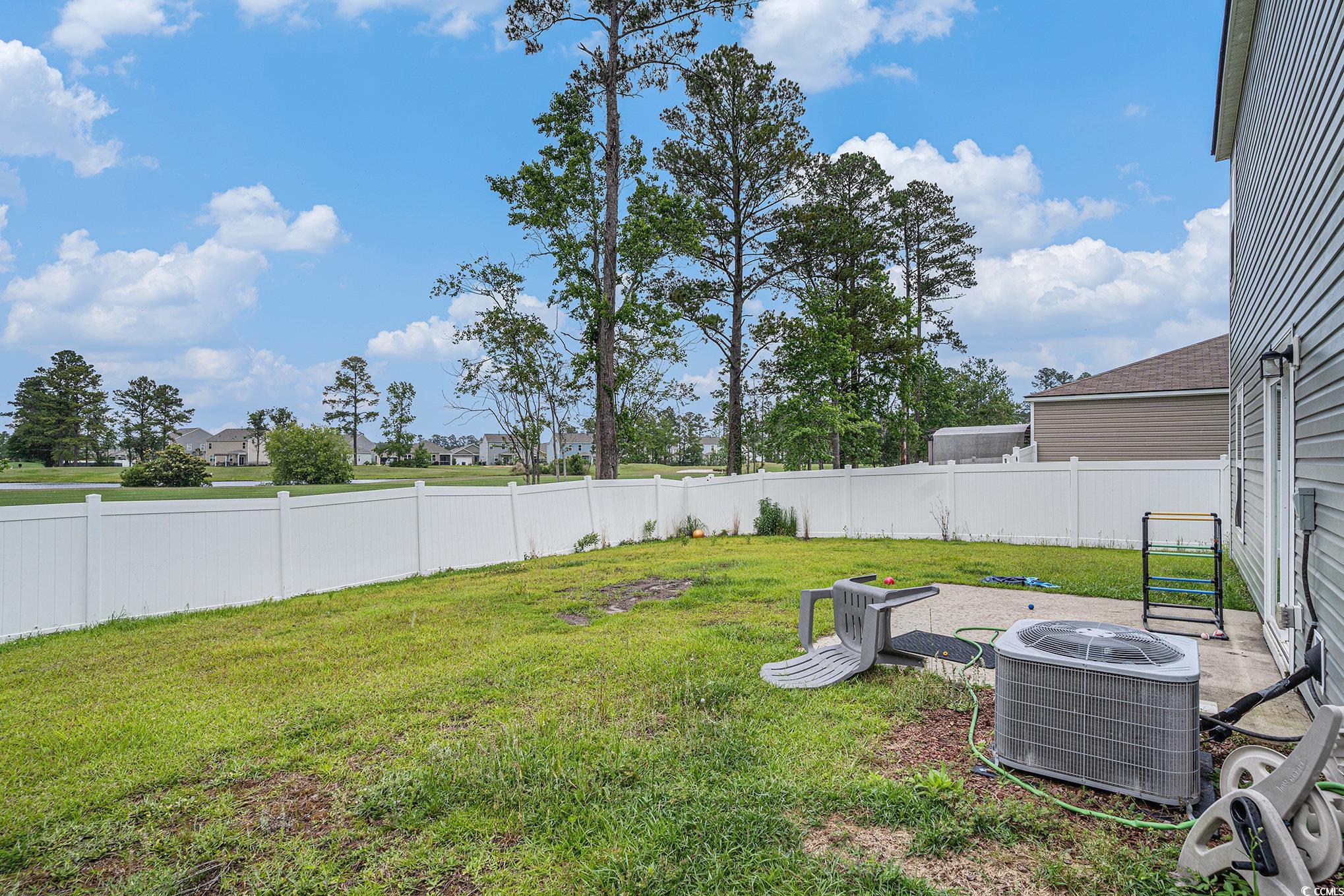 2059 Borgata Loop Longs, SC 29568 - Photo 26 of 34 View of yard featuring central air condition unit