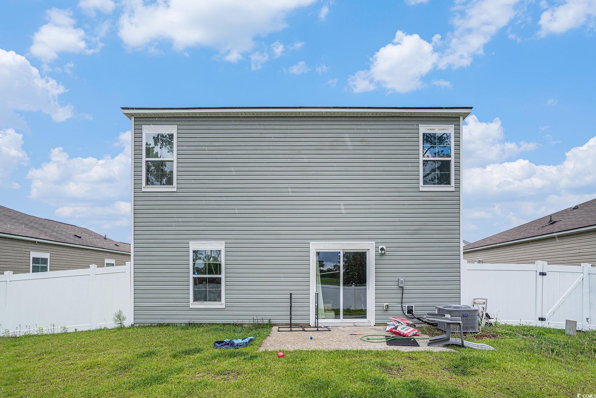 2059 Borgata Loop Longs, SC 29568 - Photo 28 of 34 Rear view of house featuring central air condition