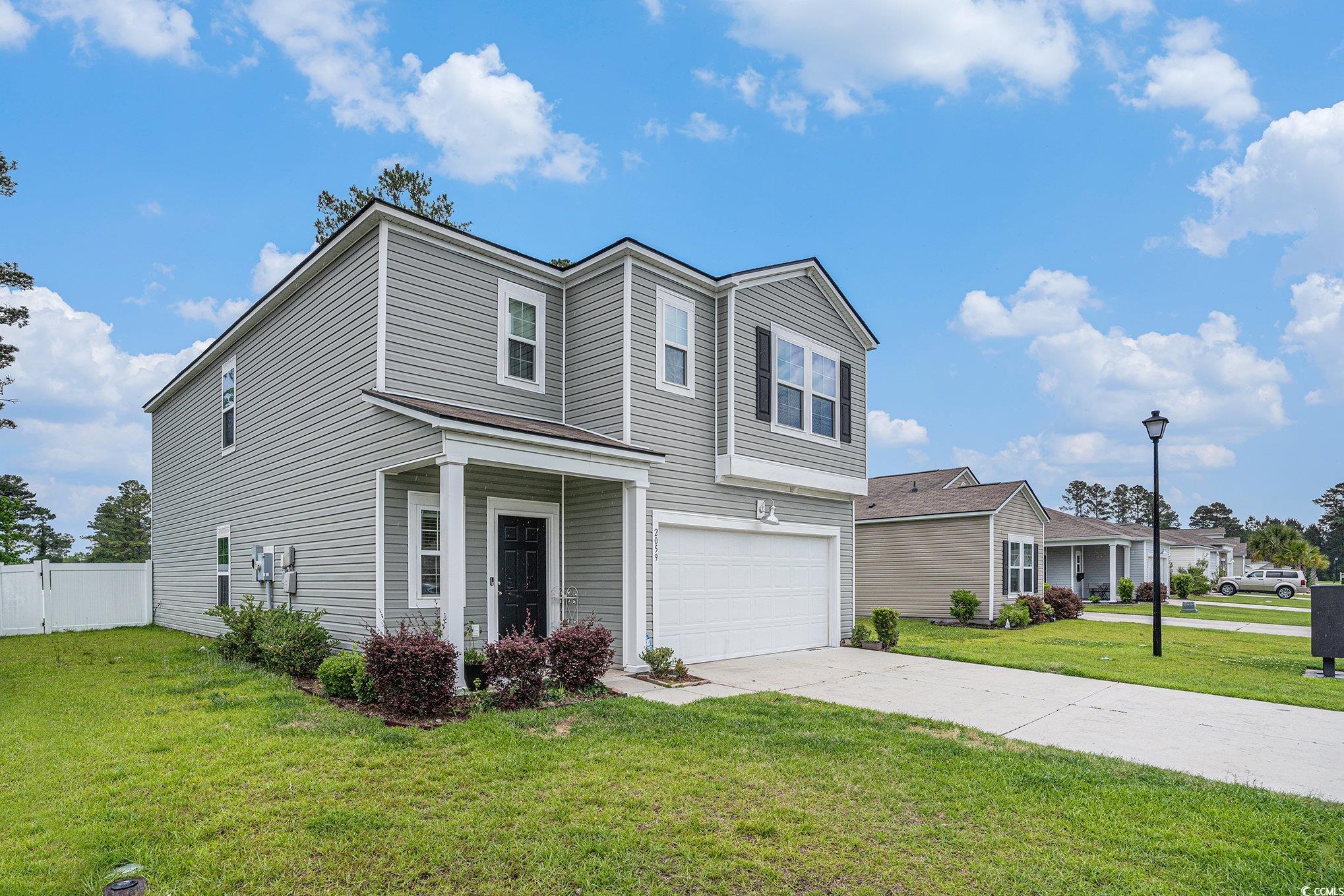 2059 Borgata Loop Longs, SC 29568 - Photo 7 of 34 Traditional-style home with a garage and concrete