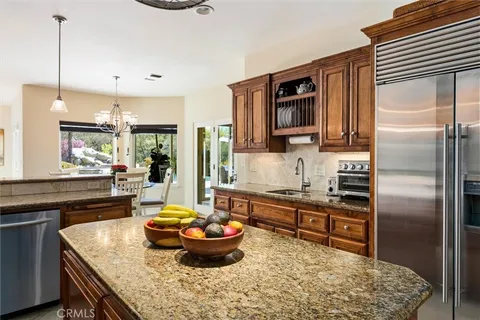 a kitchen with a stove and a refrigerator