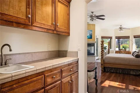 a kitchen with stainless steel appliances granite countertop a sink and cabinets