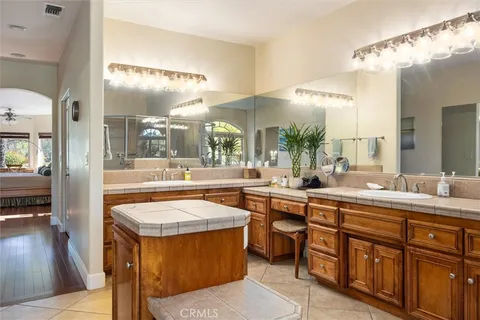 a large bathroom with a large tub and sink