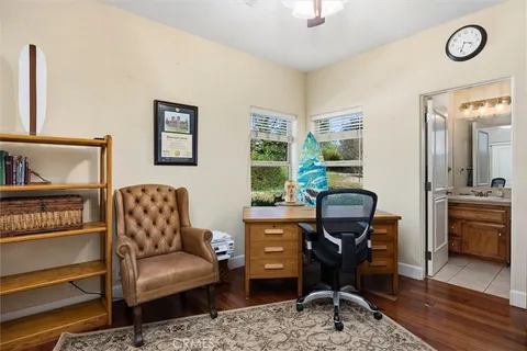 a living room with furniture a table and chair