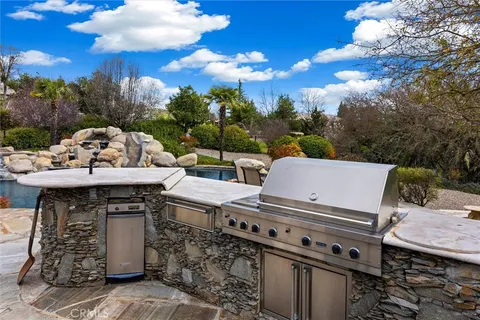a view of a patio with a table and chairs