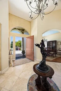 a view of a lobby with table and chairs