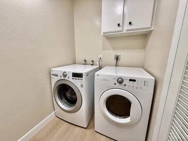 a living room with furniture kitchen and a table