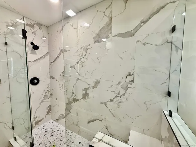 an aerial view of a houses with city view