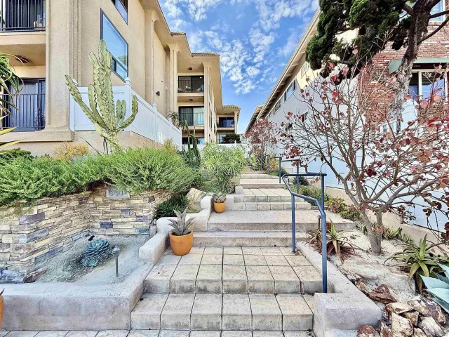 a view of multiple houses and a yard