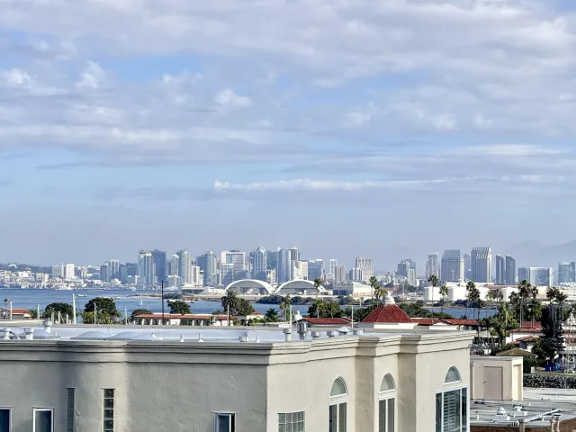 a kitchen with stainless steel appliances granite countertop a sink a stove and a wooden cabinets