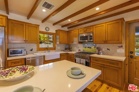 a bathroom with a sink a vanity and a mirror
