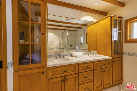 a view of a balcony with wooden floor