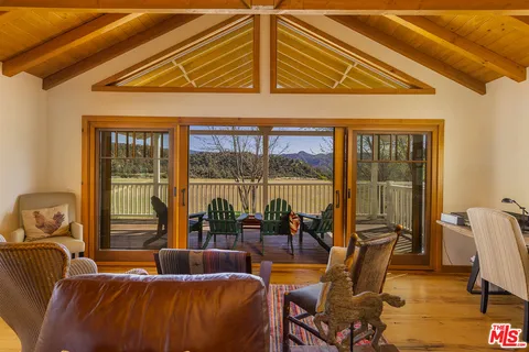 a view of swimming pool with seating area