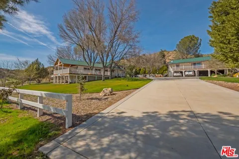 a view of a park with large trees