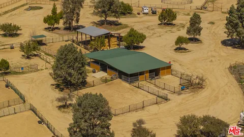 a bedroom with a bed and a night stand