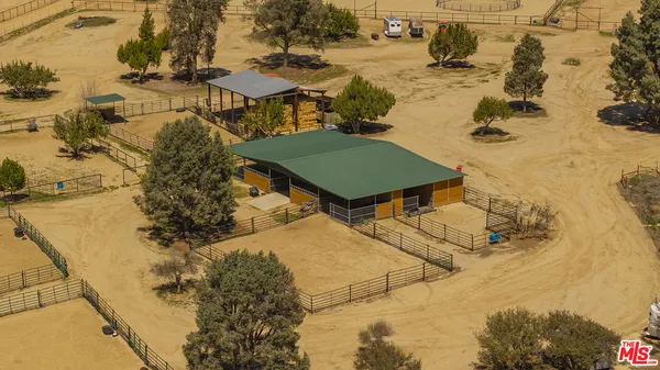 a bedroom with a bed and a night stand